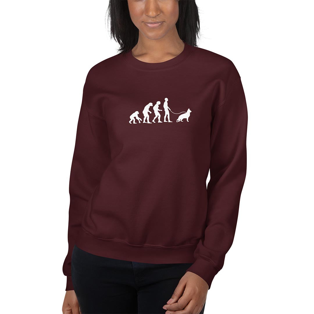 Woman in Human Evolution sweatshirt for German Shepherd lovers and owners, red color - GSD Colony