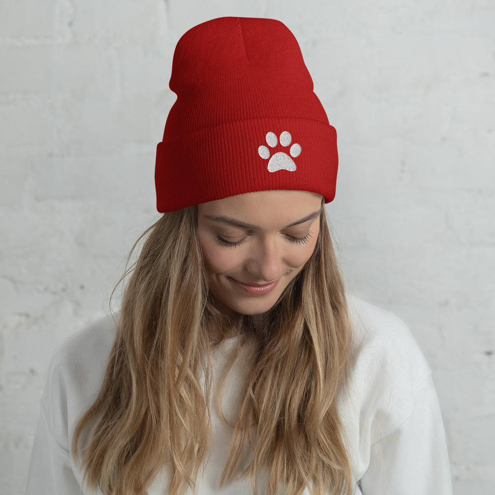 Model wearing Paw Beanie hat for German Shepherd lovers and owners, red color - GSD Colony