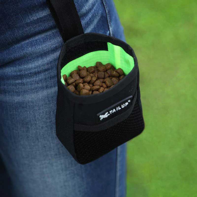 Dog handler use GSD Colony black treat pouch full with dog treats