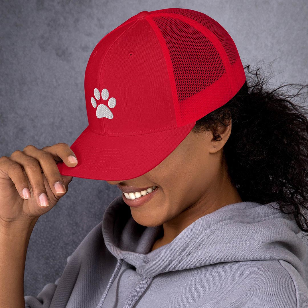 Model in Paw print trucker cap made for German Shepherd lovers and owners, red color - GSD Colony